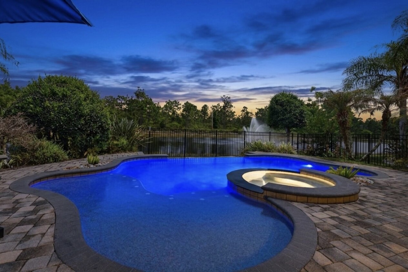 Pool and spa overlooking a lake